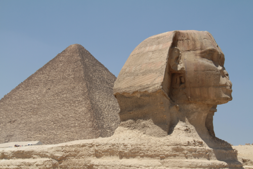 Brown Concrete Pyramid Under Blue Sky by Florian Gerus from Pexels via Canva.